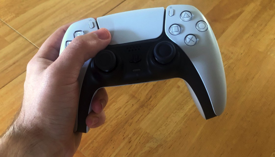 PlayStation controller in hand