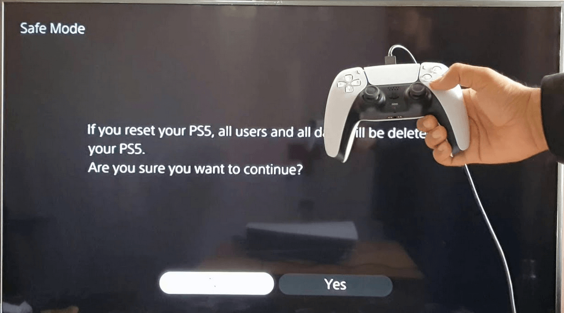 A gamer resetting PS5